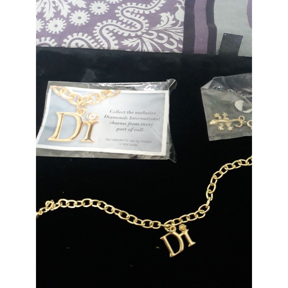 Goldtone charm bracelet free charm